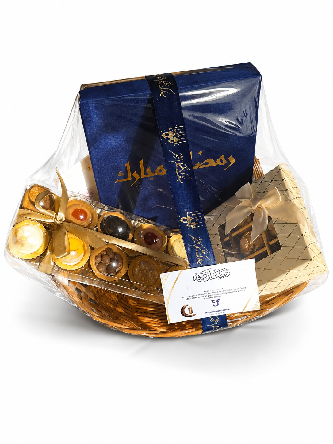 Ramadan corporate gift hamper in a wicker basket with a navy Ramadan Mubarak box, chocolates and a greeting card