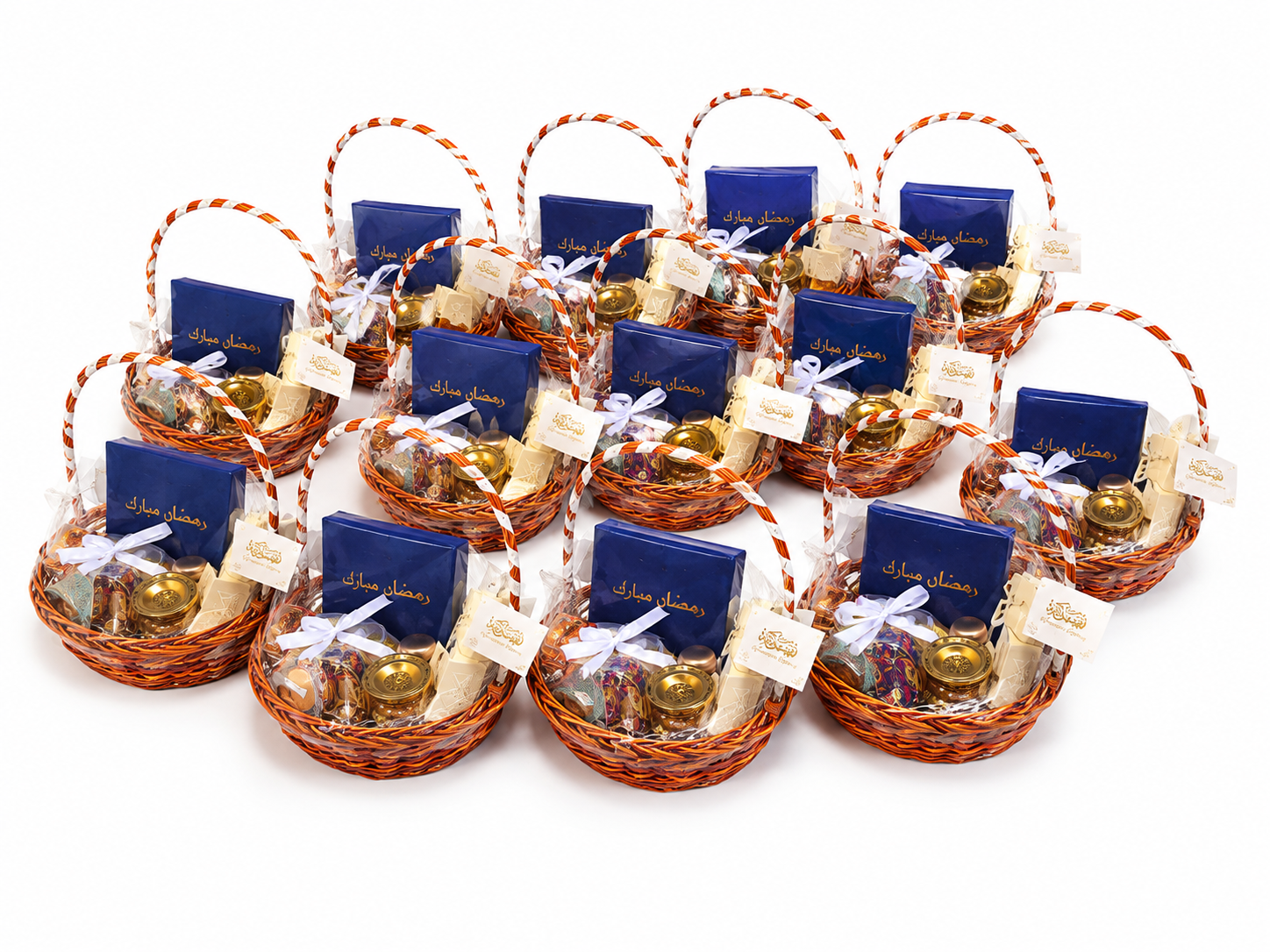 Bulk order of Ramadan corporate gift hampers in wicker baskets with navy gift boxes and ribbons