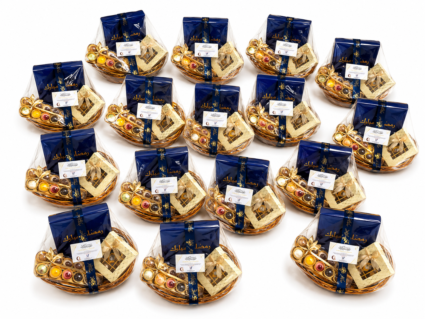 Rows of wrapped Ramadan corporate gift hampers with navy boxes, chocolates and personalised cards