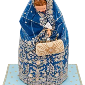 Embroidered blue outfit draped on a doll form holding a beaded clutch, on a light blue embroidered base