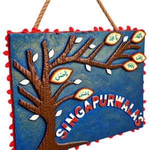 Blue family tree nameplate with lettered leaves and the family name in raised letters