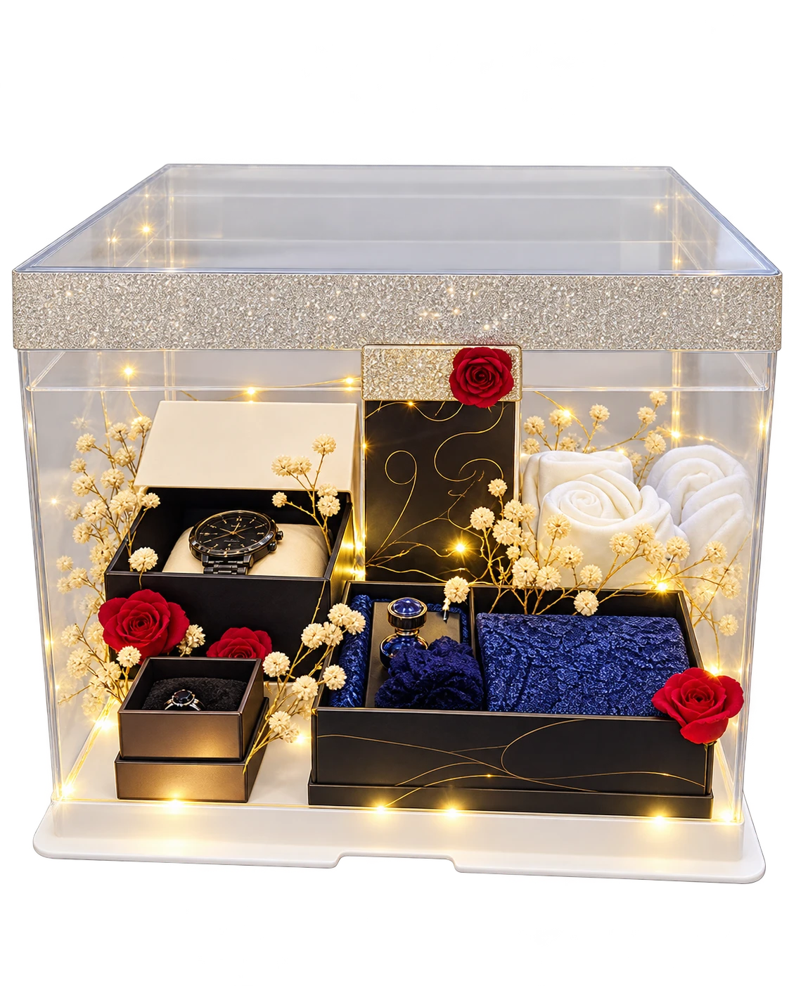 Acrylic display box with fairy lights holding a watch, ring, cufflinks, navy pocket squares and rolled white towels
