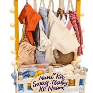 Wardrobe style baby hamper with a Nani Ka Swag, Baby Ke Naam sign, baby clothes, toys and fairy lights