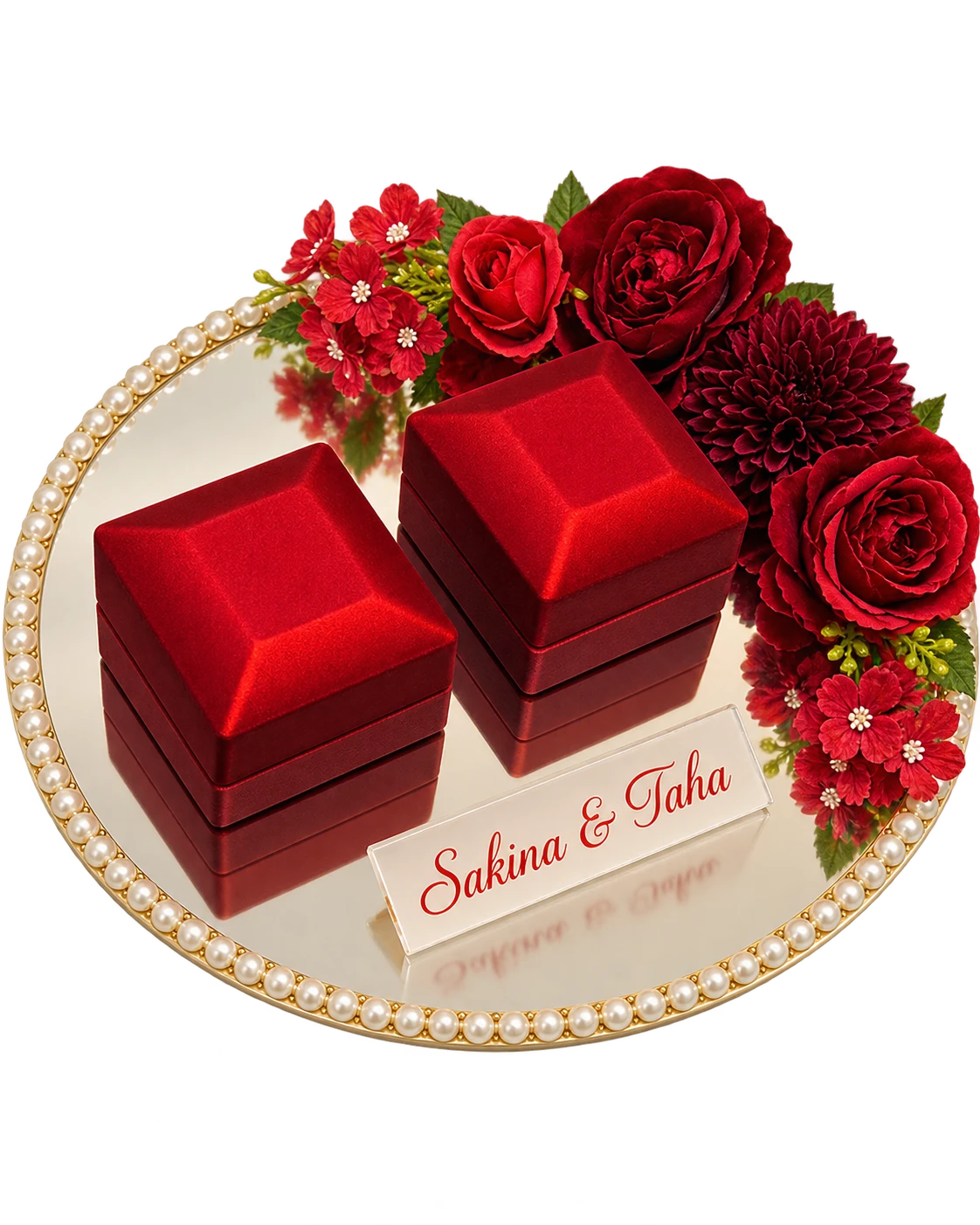 Round mirror ring tray with a pearl border, two red ring boxes, red flowers and an acrylic name plaque