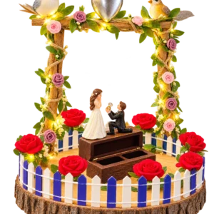 Wooden ring box with a proposing couple under a flower arch with fairy lights, birds and a picket fence